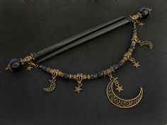 "Set of two beautiful hair sticks with blue goldstone (know also as sandstone / stellaria / night of Kairo) round beads in various sizes. Along with two hair sticks, there is a beautiful, long REMOVABLE pendant / chain - which gives you more possibilities to create beautiful up-do. Chain is decorated with moons and stars. If you're not currently into connected hair sticks, you can simply take off the pendant. * Total length: 17,6cm / 6,9\" * Usable length: 13,5cm / 5,3\" * Pendant length: 19,5cm Wooden Hair Sticks, Japanese Kanzashi, Estilo Hippie, Japanese Hairstyle, Magical Jewelry, Blue Goldstone, Fantasy Jewelry, Diy Schmuck, Hair Sticks