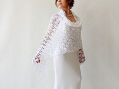 White Mohair Shawl MATERİAL: Mohair 20%, acrylic 80% COLOR: White as shown MEASUREMENTS:  Length: 78'' (200cm) Width: 39'' (100cm) CARE INSTRUCTIONS: - Handwash or wash at low temperature on a gentle machine cycle - Use a mild, non-biological detergent   More shawls and wraps in my shop: https://www.etsy.com/shop/Minnoshko?ref=l2-shopheader-name§ion_id=20621720 More handmade accessories and clothing in my shop: https://www.etsy.com/shop/Minnoshko?ref=l2-shop-header-avatar İf you purchase 3 or mo Elegant White Crochet Lace Shawl, Elegant White Shawl With Crochet Lace, Elegant White Shawl As Gift, Fitted Shawl For Mother Of The Bride, Elegant White Shawl For Gift, Elegant White Shawl Gift, Elegant Fitted Lace Shawl, Crochet Lace Shawl For Wedding, Elegant Lace Shawl Scarf