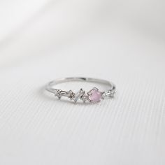 This eclectic ring has an array of crystals in different colours and shapes to form a unique, distinct design. Main material: Rose Gold, Rhodium, 16k Gold Plated on Brass, Cubic Zirconia * Tarnish-resistant protective coating Need some jewelry inspiration? Follow us on Instagram  @statementGrey Dainty Crystal Ring For Proposal, Dainty Silver Crystal Proposal Ring, Dainty Pink Crystal Ring, Dainty Pink Crystal Promise Ring, Trendy Rings, Memorial Ring, Casual Rings, Tiny Rings, Trendy Ring