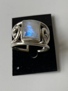 Sterling Silver Wire Ring with bezel-set square shaped Rainbow Moonstone (semi-precious stone), new Genuine 925 Sterling Silver For women or men, new Sizes: 17 - DE (N - UK size) | 18 - DE (Q - UK size)  | 19 - DE (R1/2 - UK size) Open, adjustable Matching bracelets available (see Bracelet section) Every stone has a unique pattern. Each item is carefully handcrafted by a small group of local crafts men in Nepal, to own design, thus minor variations may occur. Adjustable Sterling Silver Ring With Rectangular Stone, Adjustable Silver Hallmarked Moonstone Ring, Silver Jewelry With Rectangular Natural Stones, Adjustable Silver Moonstone Ring With Natural Stones, Adjustable Rectangular Sterling Silver Ring, Adjustable Silver Moonstone Ring Hallmarked, Adjustable Moonstone Ring Stamped 925, Adjustable Ring With Rectangular Stone For Gift, Adjustable Jewelry With Rectangular Stone For Gift