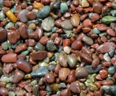 many different colored rocks and gravel together