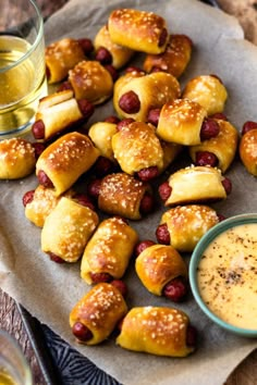 small pastries on a plate with dipping sauce