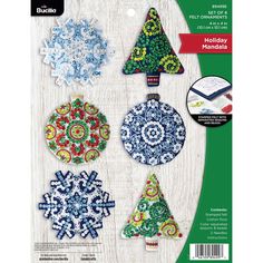 the paper house christmas ornament kit is shown in four different colors and designs