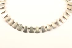 This is Vintage Teeth Design Necklace Condition: Vintage Metal: Sterling .925 Silver Weight: 73 grams Size: 15.5 in Images you see are actual pictures of jewelry you will receive Every purchase comes thoughtfully packaged and ships within 1 business day New York State buyer will be charged sales tax Feel free to contact us with any questions. We are open Mon-Fri 9-5 EST We appreciate your business Contemporary Hallmarked Jewelry As Gift, Modern Sterling Silver Necklace For Collectors, Modernist Silver Necklace For Gift, Axes Design, Teeth Design, New York State, Axes, Vintage Metal, Chains Necklace