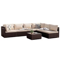 an outdoor sectional sofa with pillows and coffee table on the bottom right side, in front of a white background