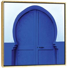 a blue door with an arch and flower design on the side of it, in front of a white wall