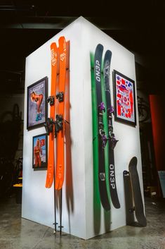 there are many skis and snowboards on display