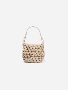 The Dora Bag is hand woven in Italy with organic rope for the optimal shoulder bag. Organic Cotton Lining:. drawstring closure . inside pocket . size: h 33 x w 31 cm CARE INSTRUCTIONS. 100% organic cotton . dry clean Beige Cotton Bucket Bag With Adjustable Strap, Casual Braided Tote Bucket Bag, Casual Braided Bucket Crochet Bag, Casual Cream Jute Bag, Casual Braided Crochet Bucket Bag, Beige Cotton Shoulder Bucket Bag, Everyday Braided Bucket Tote Bag, Everyday Braided Tote Bucket Bag, Casual Woven Natural Bucket Bag