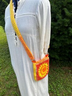 Vibrant summer bag in playful shades of orange and yellow.   Features a trendy sun and moon design on both sides, accented with an ombre of yellow/orange  and coordinating orange marbled lining.    The Adjustable strap( up to 44")  is also  lined with fabric prevent stretching. It also works great as a belted fanny pack, you can run the strap through belt loops, it can then double as a belt and a hanging bag!    At approx 8" x 8" it's  perfect size for all your essentials (phone, wallet, keys, e Sun And Moon Design, Orange Purse, Summer Bag, Orange Bag, Hanging Bag, Orange And Yellow, Moon Design, Sun And Moon, Shades Of Orange