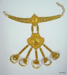 "20K GOLD BRACELET DORSAL HAND ORNAMENT (HATHPHUL; HATH HAKALU; PANCHANGALA), THAT INCLUDES, IN ADDITION TO THE USUAL ELEMENTS, ORNAMENTS FOR THE FINGER ENDS. Great design bracelet with 5 finger rings attached (hathful).Rings are attached with the middle piece by handmade chains. See similar sample in\" Traditional jewelry of India\" by Oppi Untracht. Size of the bracelet - 19.3 cm(7.6\") we can adjust the size. Ring sizes - Free size weight - 51.8 grams Material - 20k yellow gold." Traditional Bangle Anklets For Festive Occasion, Traditional Gold Bracelets For Festival, Traditional Festival Bracelet Jewelry, Temple Jewelry Toe Ring For Festivals, Handmade Temple Jewelry Anklets For Festive Occasion, Traditional Gold Bracelet For Festival, Traditional Gold Festival Bracelets, Handmade Temple Jewelry Anklets, Vintage Gold Bracelets For Rituals