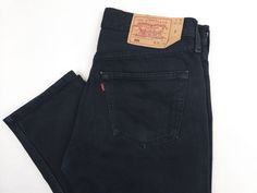 Free shipping for two or more items. Add to cart and check. Vintage Levi's 501 jeans 1990s, black Color. Made in UK(Europe), Factory 299,  1999'. FABRIC: 100% cotton denim SIZE on tag: 32 x 30.  Please refer to measurements: Waist: 31 inch / 79 cm Hips: 43 inch / 109 cm Thigh: 22 inch / 57 cm Inner length: 30 inch / 76 cm Outer length: 40 inch / 101 cm Leg opening: 15 inch / 38 cm Front rise: 11 inch / 28 cm Back rise: 14,5 inch / 37 cm Feel free to ask any questions. If you are looking for simi Straight Leg Levis, Levis 501 Black, Levi 501 Jeans, New Advertisement, Streetwear Jackets, Levis Vintage, Vintage Sportswear, Vintage Trousers, Vintage Levis 501