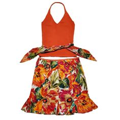 Bandolino Tropical Floral Skirt Set New With Tags Stretchy Coral Halter Top With Scarf Tie That Matches Skirt Size Ps Approx. Measurements: Pit To Pit Flat 14", Length 19" Material - 53% Silk, 28% Nylon, 19% Cotton Floral Mini Skirt With Ruffle Size 10p Approx. Measurements: Waist 30", Length 19" Material - 97% Cotton, 3% Spandex Side Zip Orange Floral Print Skirt, Orange Skirt For Summer Vacation, Orange Skirted Skort For Spring, Spring Orange Skirted Skort, Fitted Floral Print Skort For Vacation, Orange Floral Print Skirt For Day Out, Orange Skort For Summer, Summer Orange Skirt For Vacation, Orange Cotton Skirt For Day Out