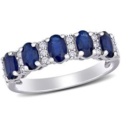 a white gold ring with blue sapphire and diamonds