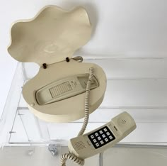 an old phone is hanging from the ceiling