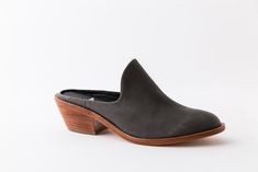 Classic Mules With Contrasting Heel Counter, Slip-on Low Heel Leather Mules, Leather Low Heel Slip-on Mules, Leather Slip-on Mules With Low Heel, Chic Leather Sole Almond Toe Mules, Chic Pointed Toe Clogs With Rubber Sole, Classic Almond Toe Mules With Contrasting Heel Counter, Low Heel Mules With Stacked Heel For Work, Casual Closed Toe Mules With Sculpted Heel