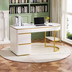 a desk with a laptop on it in front of a bookshelf filled with books