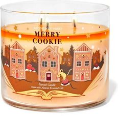 a candle that is sitting in front of a white background with the words merry cookie on it