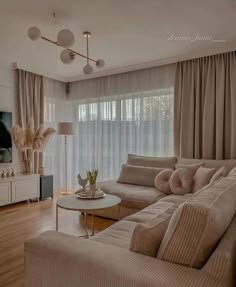 a living room filled with furniture and a flat screen tv