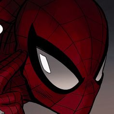 a close up of a spider - man with his eyes open and hands on his face