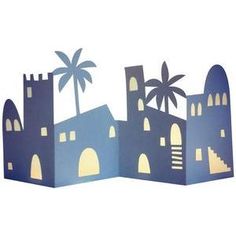 a paper cut out of a castle with palm trees