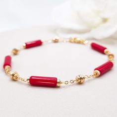 Beautiful handcrafted red coral bracelet with gold hematite brads. Made with high-quality gemstones, this statement bracelet radiates confidence and style, making it the perfect addition to any jewelry collection. With its bold red-gold hues and intricate design, this bracelet is sure to turn heads wherever you go. MATCHING RED CORAL EARRINGS: https://www.etsy.com/au/listing/1746209030/red-coral-earrings-for-women-handmade * Materials: 18k gold plated chain and clasp * Gemstone: Red coral stone Elegant Natural Stones Beaded Bracelet, Gold Red Coral Bracelets As Gift, Gold Red Coral Bracelets For Gifts, Gold Red Coral Bracelet As A Gift, Gold Bracelets With Red Coral As Gift, Gold Red Coral Bracelet For Gift, Elegant Gemstone Beaded Bracelet Gift, Elegant Red Coral Beaded Bracelets For Gift, Elegant Red Coral Beaded Bracelet Gift