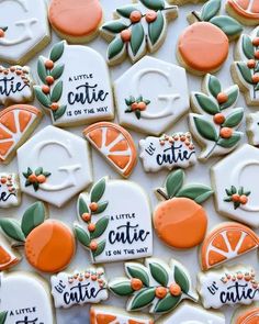 decorated cookies with oranges and words on them