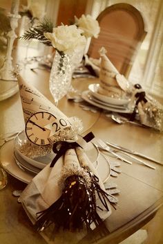 a party hat sitting on top of a table next to silverware and napkins