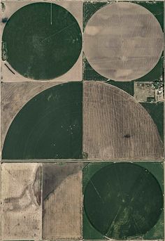 an aerial view of four circles in the middle of a field with grass and dirt