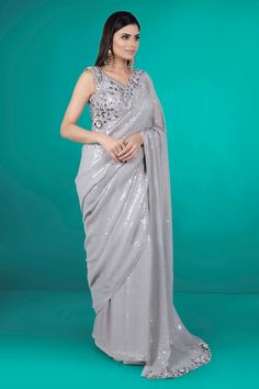 "Get ready to steal the show in this Party Wear Saree D-209! The sequence work adds a touch of glamour to this already stunning piece. Turn heads and make a statement as you strut your stuff in this beautiful saree. Perfect for any special occasion. Extra fabric inside the blouse Waist is stretchable Hand Embellished Fitted Pre-draped Saree For Party, Elegant Pre-draped Saree For Party Season, Glamorous Hand Embellished Pre-draped Saree For Party, Glamorous Gown With Sequins In Saree Style, Elegant Fitted Pre-draped Saree For Party Season, Formal Party Wear Saree With Sequins, Formal Sequined Lehenga For Diwali, Silver Bollywood Gown For Party, Silver Bollywood Style Party Gown