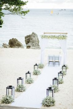 an outdoor ceremony set up on the beach