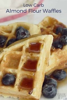 two waffles with blueberries and syrup on them