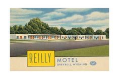 an old motel sign is shown in front of the road and trees on both sides