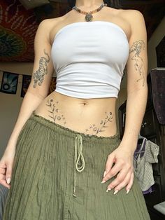 stomach tattoo, hippie tattoos, nature tattoos Above Stomach Tattoo, Tattoos And Piercings Aesthetic, Tattoos That Accentuate Waist, Tattoos Arms Womens, Stomach Hip Tattoos Women, Stomach Tattoos Around Belly Button, Small Floral Hip Tattoo, Low Stomach Tattoos Women, Lower Back Hip Tattoos Women