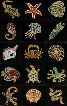 an assortment of sea animals painted on black paper