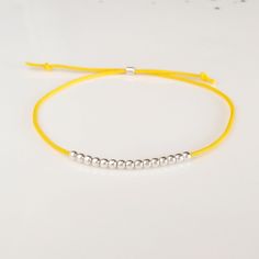 Minimalist, wearable and delicate silver multicolor thread bracelet available in several colors. Length: 20cm adjustable knot. Width: 2mm. Fully adjustable, Handmade in Spain. More colors available in this product => https://www.etsy.com/listing/845364478/tiny-simple-cord-sterling-silver-wish Ideal for a gift and for combinate with other bracelets. All our products are presented in a white organza bag. ♡ Made with love in Valencia ♡ ----------------------------- Discover the NICTE bracelets c Minimalist Silver Friendship Bracelets, Minimalist Sterling Silver Friendship Bracelets, Minimalist Handmade Friendship Bracelets, Minimalist Sterling Silver Bracelets With Adjustable Length, Minimalist Silver Friendship Bracelet With Tiny Beads, Minimalist Adjustable Friendship Bracelets, Minimalist Adjustable Silver Friendship Bracelets, Minimalist Friendship Bracelets With Sliding Knot And Round Beads, Simple Adjustable Sterling Silver Bracelets