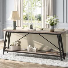 a living room with a coffee table and vases