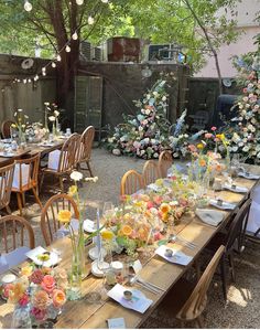 an outdoor dining area with tables and chairs set up for a formal dinner in the shade