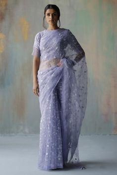 Periwinkle saree with floral embroidered motifs. Paired with blouse.
Component: 2
Pattern: Embroidery
Type Of Work: Floral
Neckline: Round
Sleeve Type: Half
Fabric: Georgette, organza
Color: Blue
Other Details: 
Tassel border
Back cut-out
Occasion: Puja - Aza Fashions Embroidered Saree, Blouse For Women, Embroidered Neckline, Organza Saree, Work Sarees, Indian Outfit, Saree With Blouse, Blouse Online, Printed Sarees