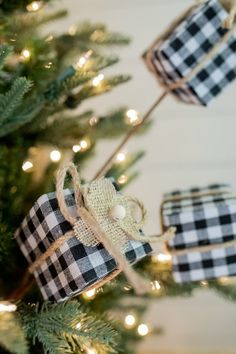 christmas tree decorated with black and white gingham ribbon, twine bows and lights