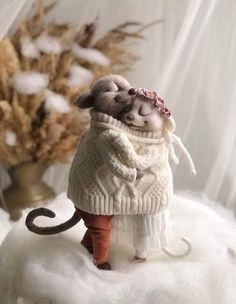 there is a small figurine on top of a snowball with a mouse in it