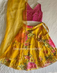 Custom made lehenga choli for kids of all ages. Fabric details- Top- Silk with gota work Lehenga- Georgette in floral print Dupatta- Net with gold trims. Made to measure. Customisation possible. Contact for kids dresses above 11 years. Can be made as a mother-daughter dress or outfit. This dress can also be made in womens size. Contact for price for women's size. Contact for custom sizing after placing the order or we will contact you after you place the order. Summer Party Wear Sets With Dupatta, Summer Lehenga With Sheer Dupatta In Georgette, Summer Georgette Lehenga With Sheer Dupatta, Summer Lehenga With Sheer Dupatta, Summer Fitted Lehenga With Sheer Dupatta, Summer Anarkali Choli With Sheer Dupatta, Summer Anarkali Lehenga With Sheer Dupatta, Designer Wear Lehenga With Traditional Drape For Summer, Summer Festive Lehenga With Traditional Drape