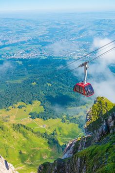 a gondola in the sky above a valley