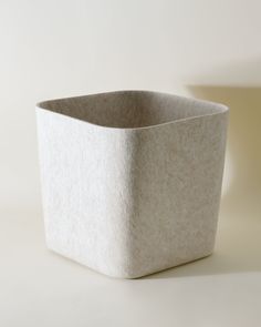 a white square container sitting on top of a table