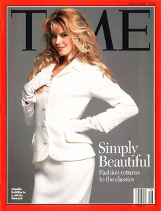 a magazine cover with a woman in a white dress