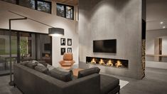 a living room with a couch, chair and fire place in front of a flat screen tv