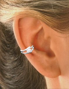 "Ear Charm's \"Eye CZ\" Ear Cuff Earring wrap, is Non-Pierced & Wraps mid side cartilage of ear & gracefully dips down in a \"V\" shape Set with a 1/4 ct. CZ in quality 4 prong settings. Looks like a second hole on most people (but, without the pain). Reversible, can be worn in EITHER Ear. Worn as a Single or a Pair Usually with your Other (pierced) Earrings or above another Ear Charm / Ear Cuff. Handcrafted our Ear Charms® Ear Cuffs are Comfortable, Fully Adjustable & Affordable in Double Pierced Earrings, Ear Cuff Women, Eye Band, Earring Cartilage, Cuff Earring, Wrap Earrings, Sedona Az, Ear Cuff Earings, Ear Cuffs