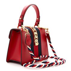 This is an authentic GUCCI Calfskin Mini Sylvie Top Handle Bag in Hibiscus Red. This structured shoulder bag is crafted of smooth red calfskin leather and features a prominent front flap detailed with a central canvas red and navy blue web stripe. A top handle and shoulder strap compliment the polished gold chain buckle lock closure. The top flap opens to a camel brown microfiber lining interior with a flat pocket. Hibiscus Red, Structured Shoulder, Handle Bag, Hibiscus, Gold Chain, Gold Chains, Top Handle, Calf Skin, Camel