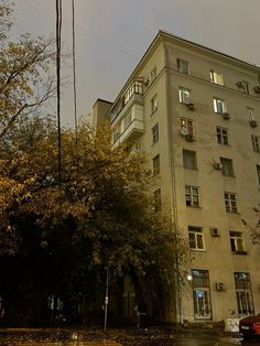 an apartment building with lots of windows and balconies