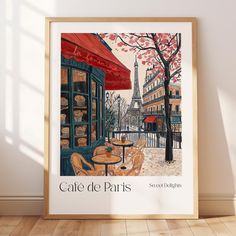 a poster with the words cafe de paris on it in front of a white wall