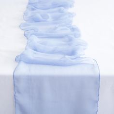 the table is covered with blue ruffles